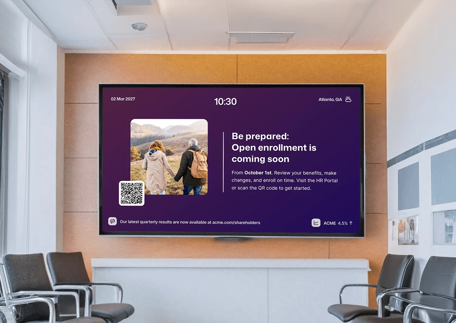 Office waiting room digital signage screen displaying an open enrollment reminder starting October 1st in Atlanta, GA, with a QR code linking to the HR portal.