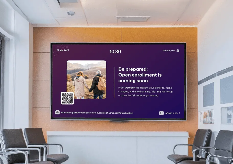 Office waiting room digital signage screen displaying an open enrollment reminder starting October 1st in Atlanta, GA, with a QR code linking to the HR portal.
