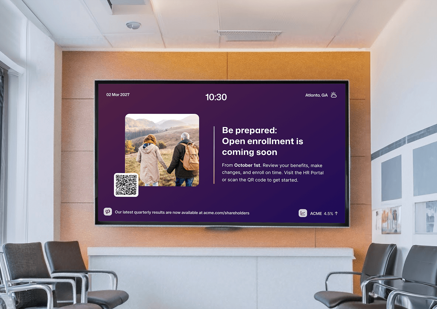 Office waiting room digital signage screen displaying an open enrollment reminder starting October 1st in Atlanta, GA, with a QR code linking to the HR portal.