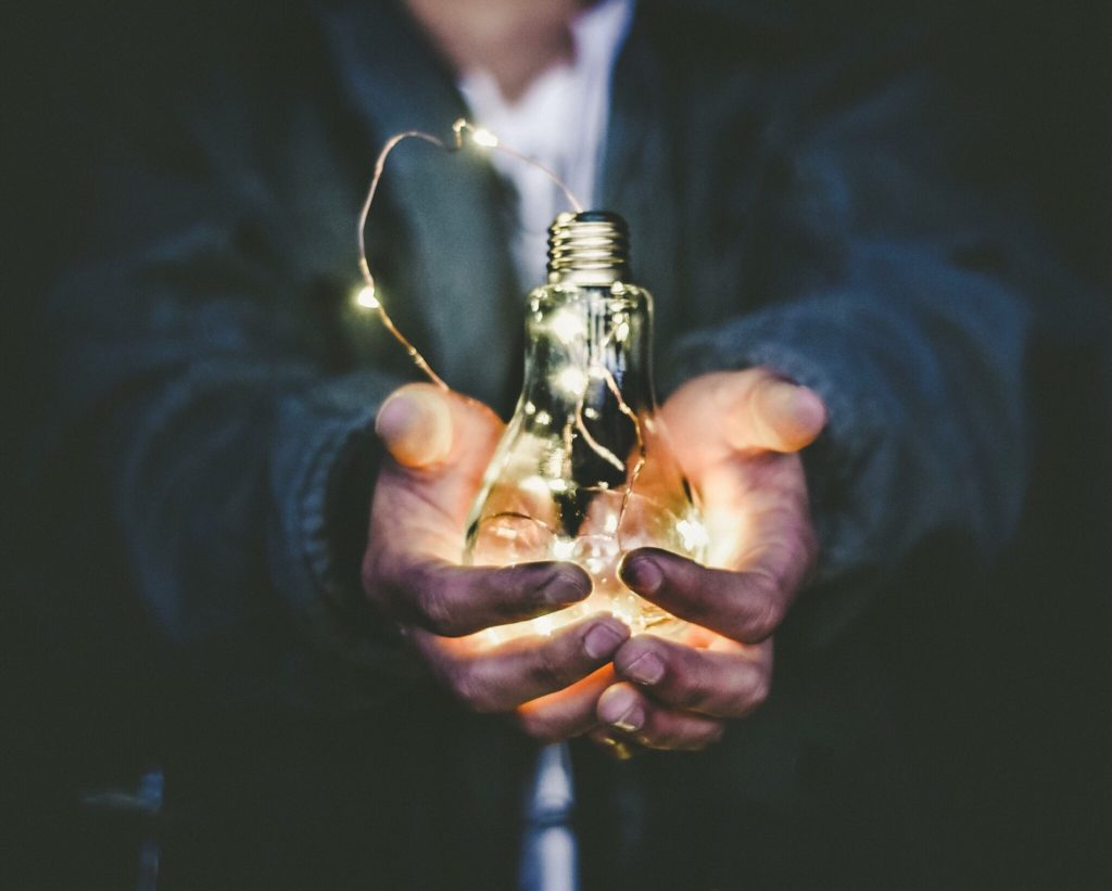 Man offering lightbulb as reward