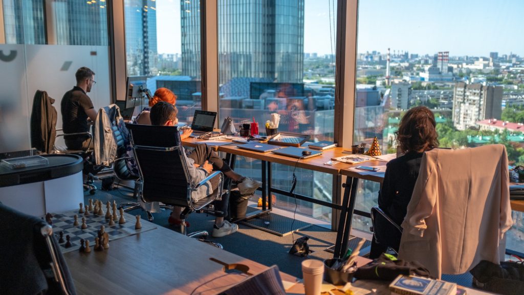 Workers at a desk with a view 