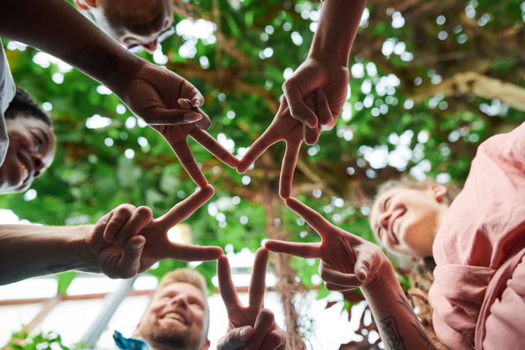 group of friends join hands