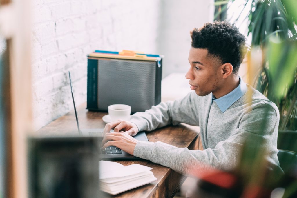 young man working at desk