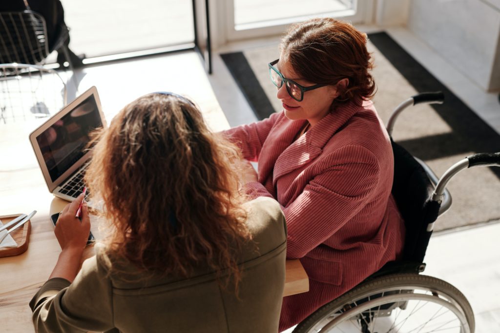 woman in wheelchair at work