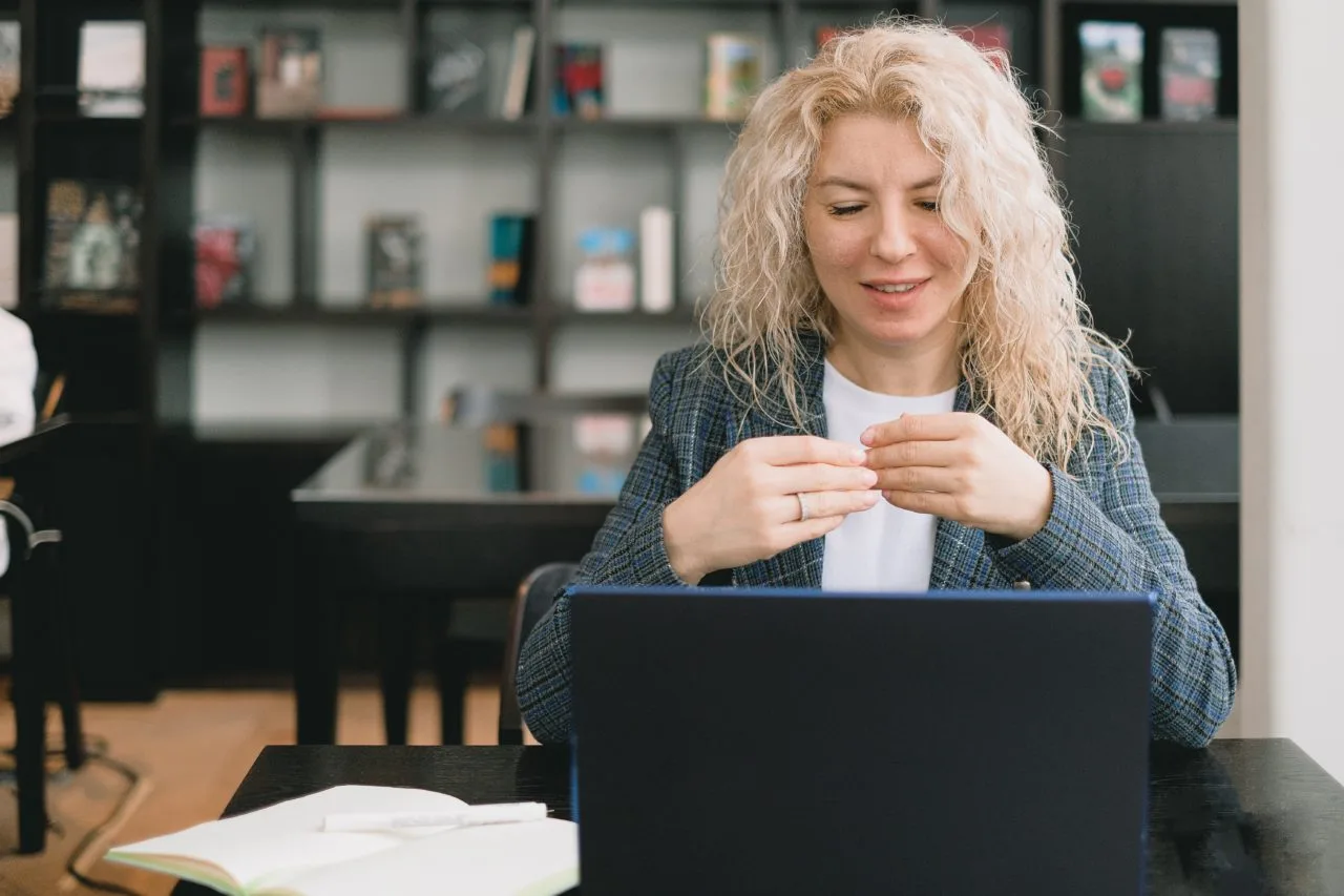 blonde woman using a laptop computer